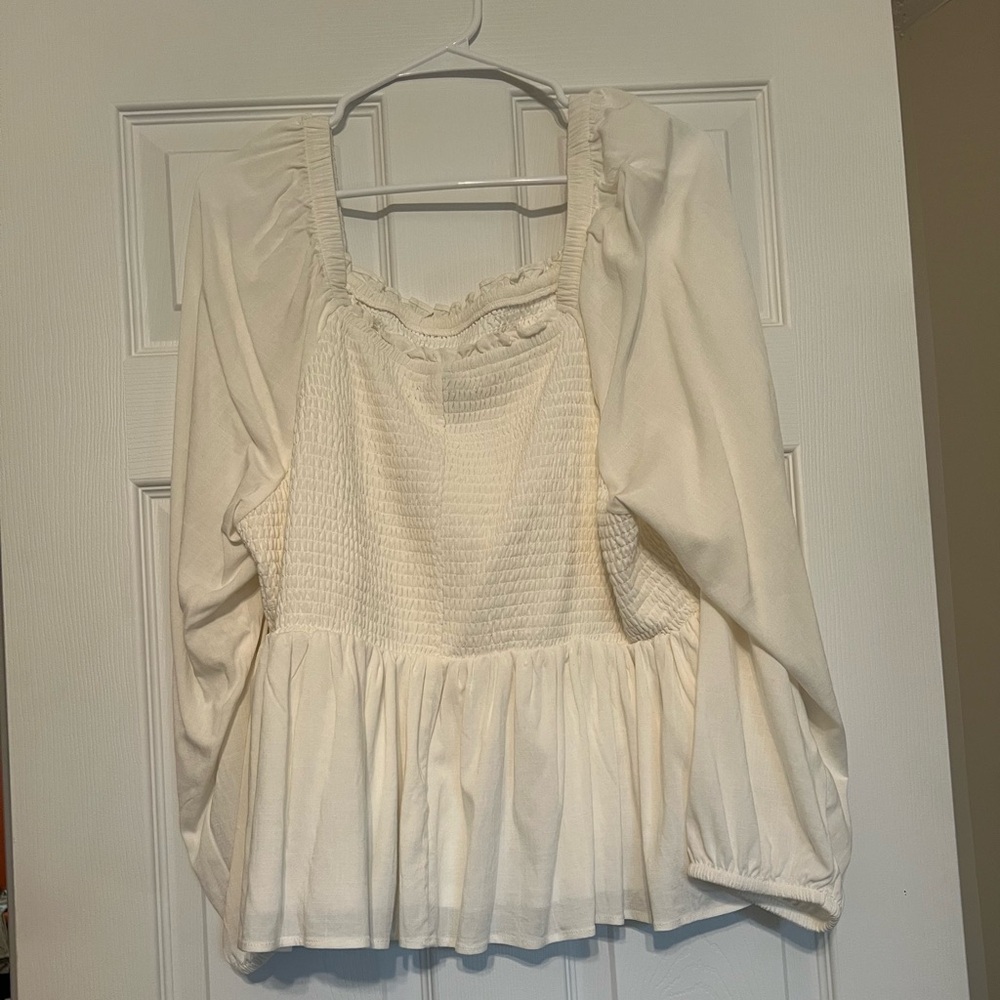 Ivory-cream colored Torrid peplum top